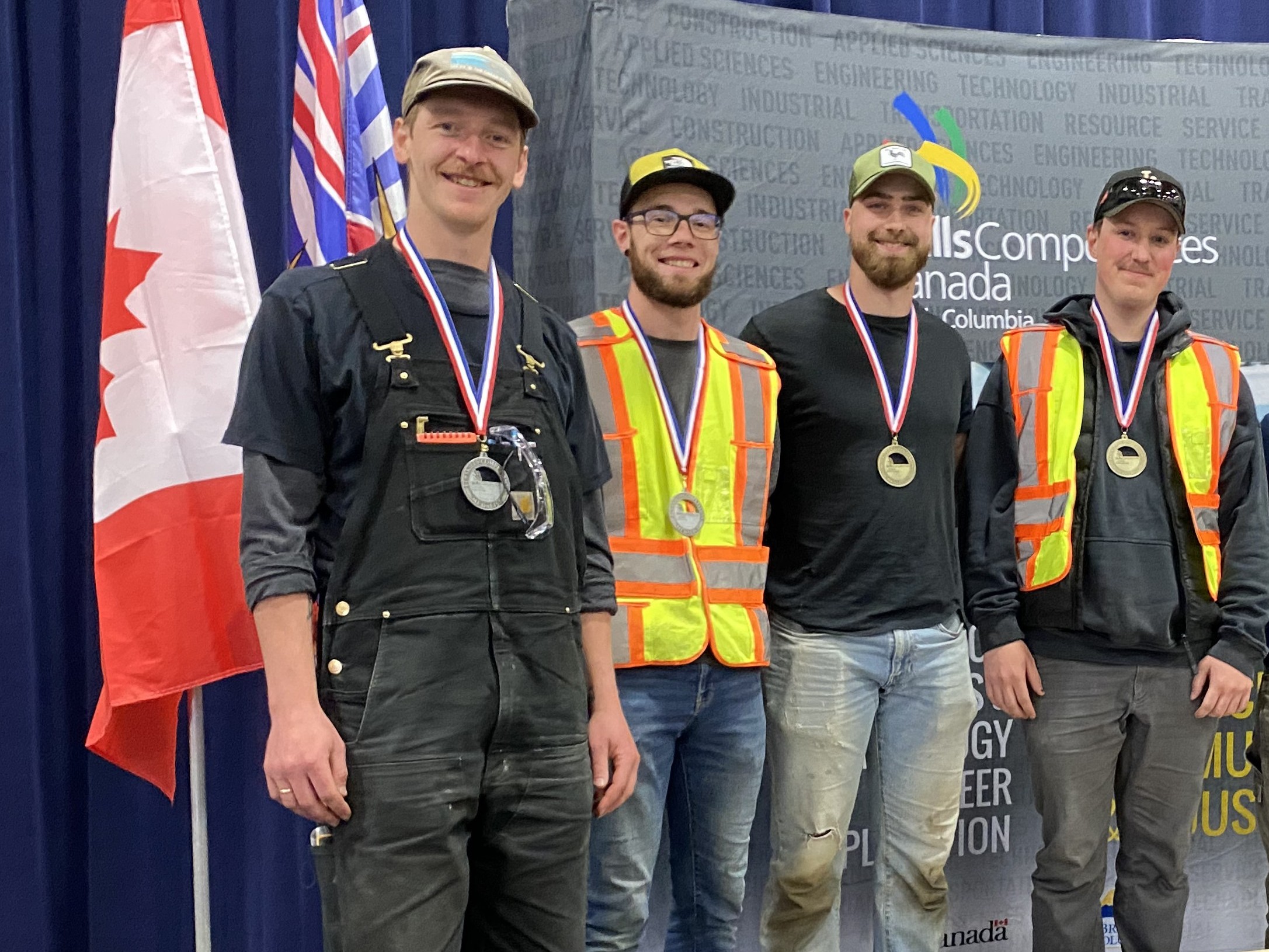 KPU students pose with gold and silver medals.