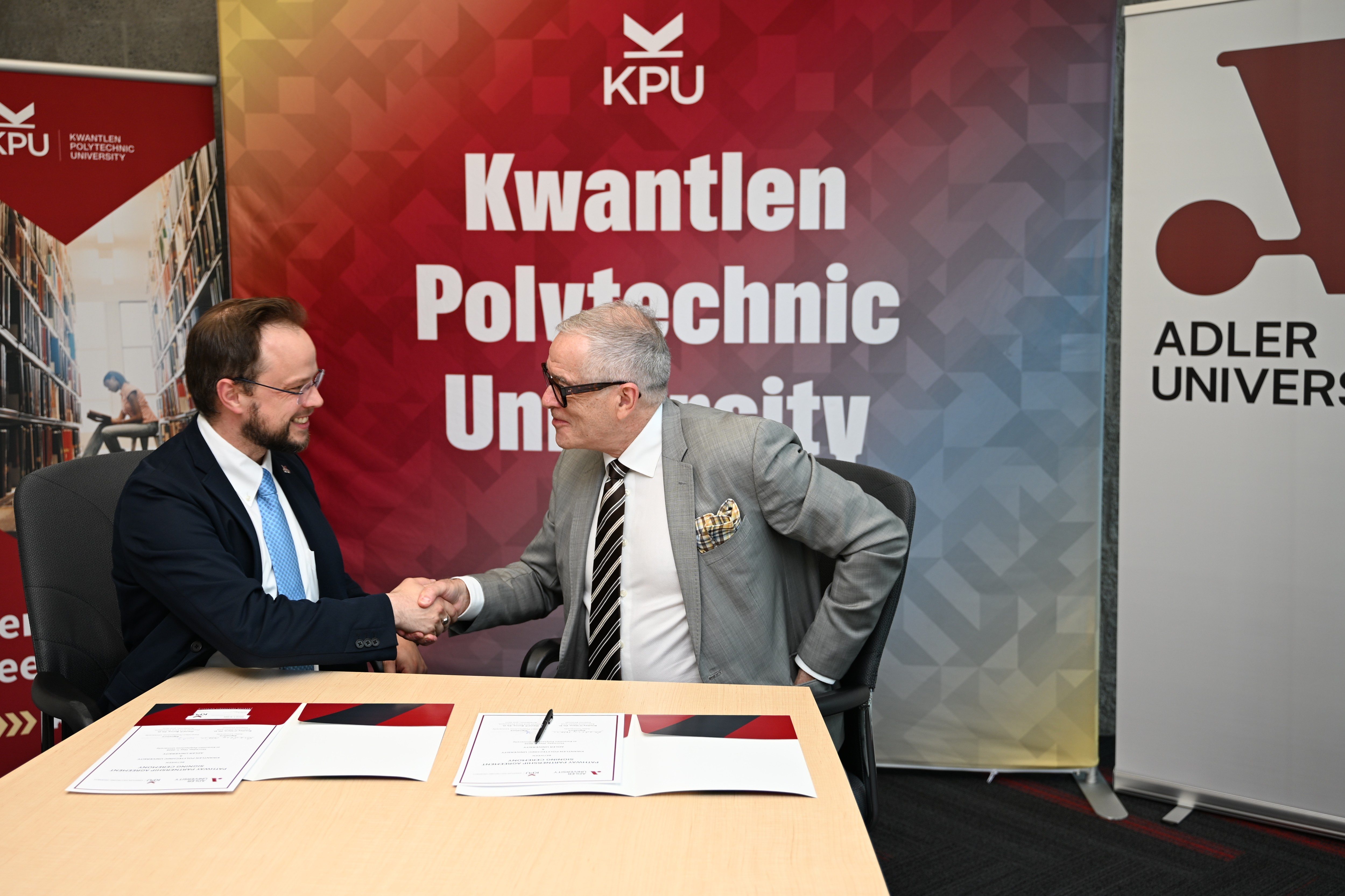 Dr. David Burns, Provost and Vice-President, Academic pro tem at KPU, and Dr. Brad O’Hara, Interim Provost at Adler University sign an agreement to expand graduate study opportunities.