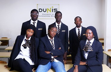 6 DUNIS Students sitting to take a picture