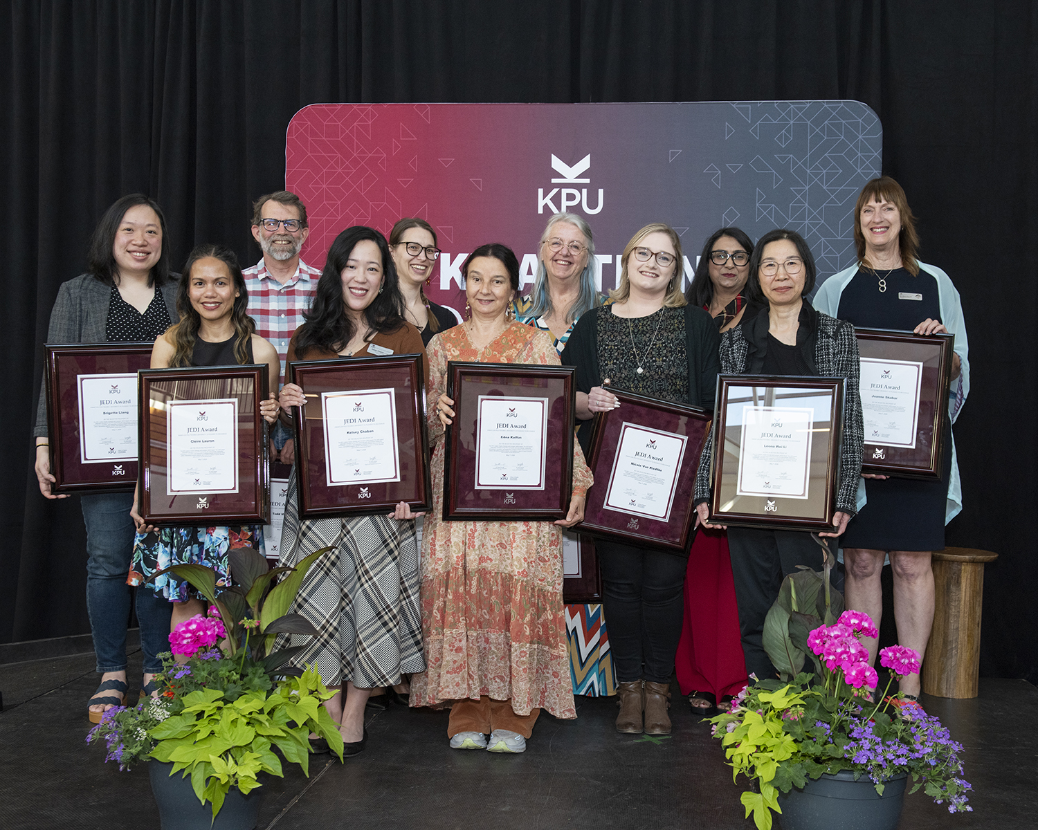 KPU library employees and award presenters stand in a group.
