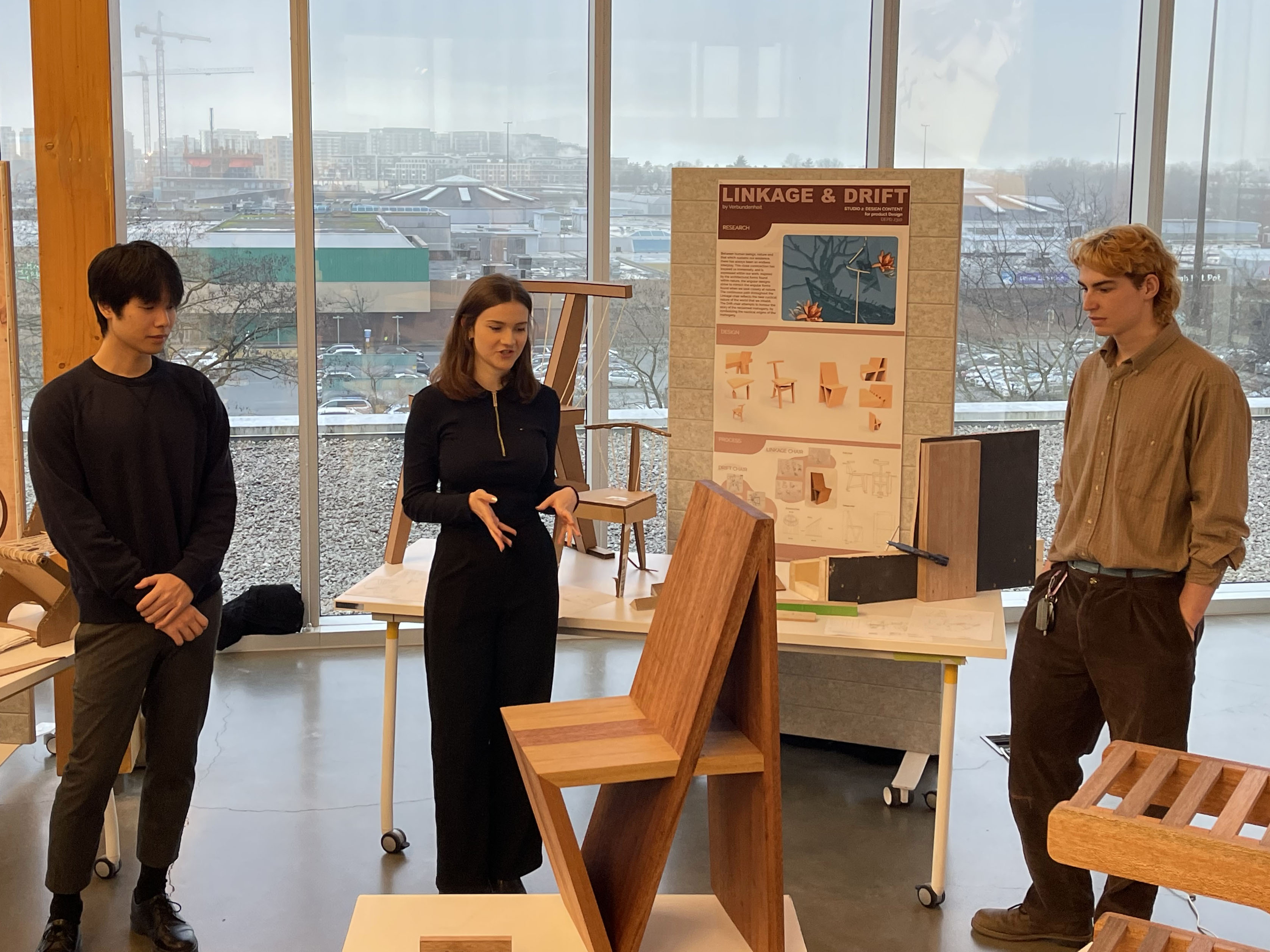 Students present their mahogany chair design.