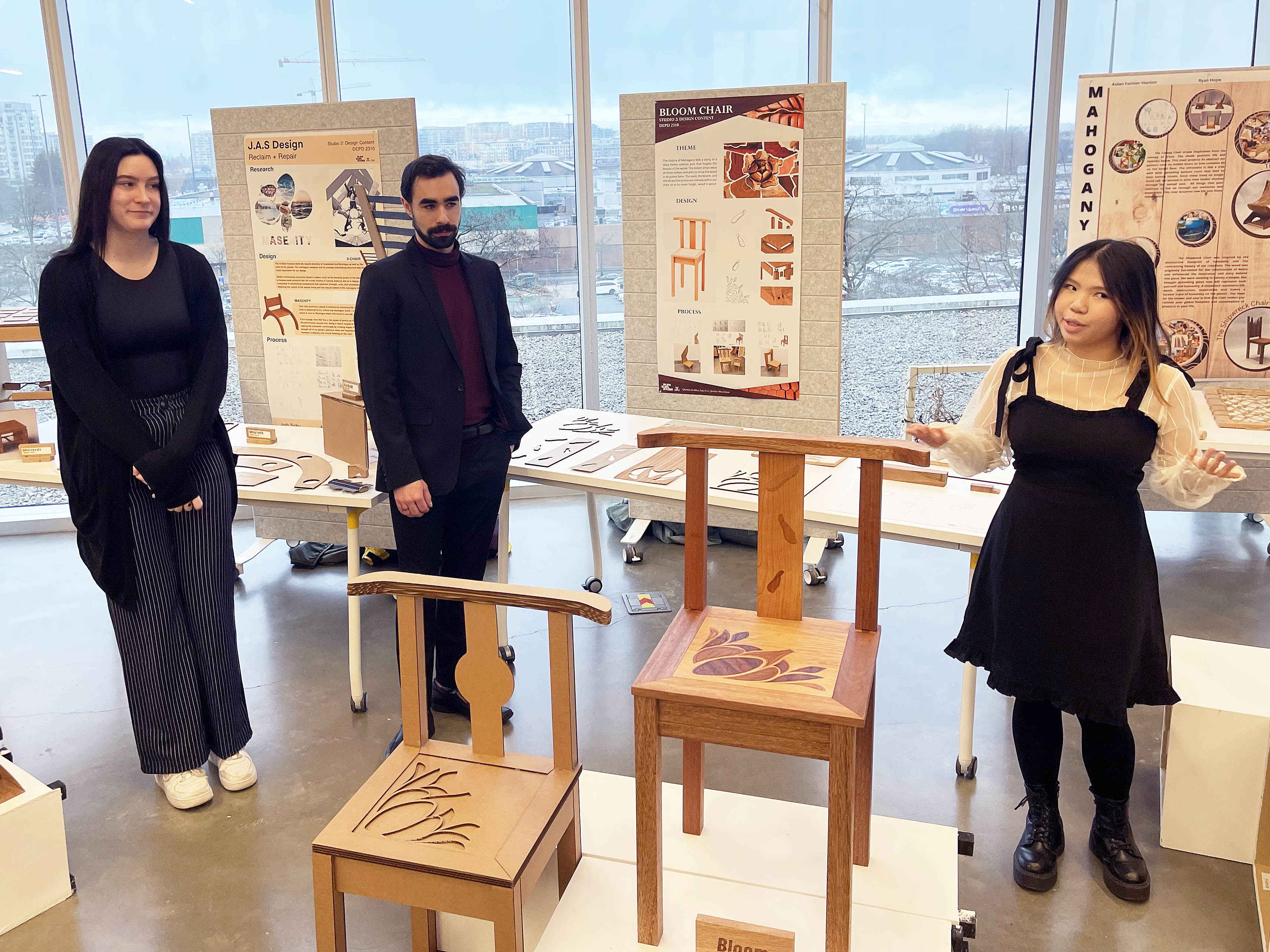 of KPU product design students (from left) Jordyn MacAdams, Quinton Kehler, and Sara Lee present the Bloom Chair.