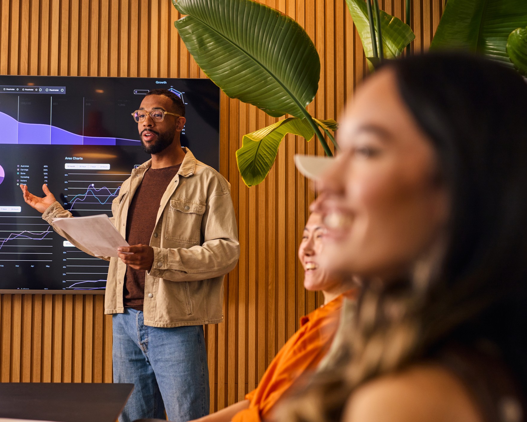 A man presenting statistics to a group.