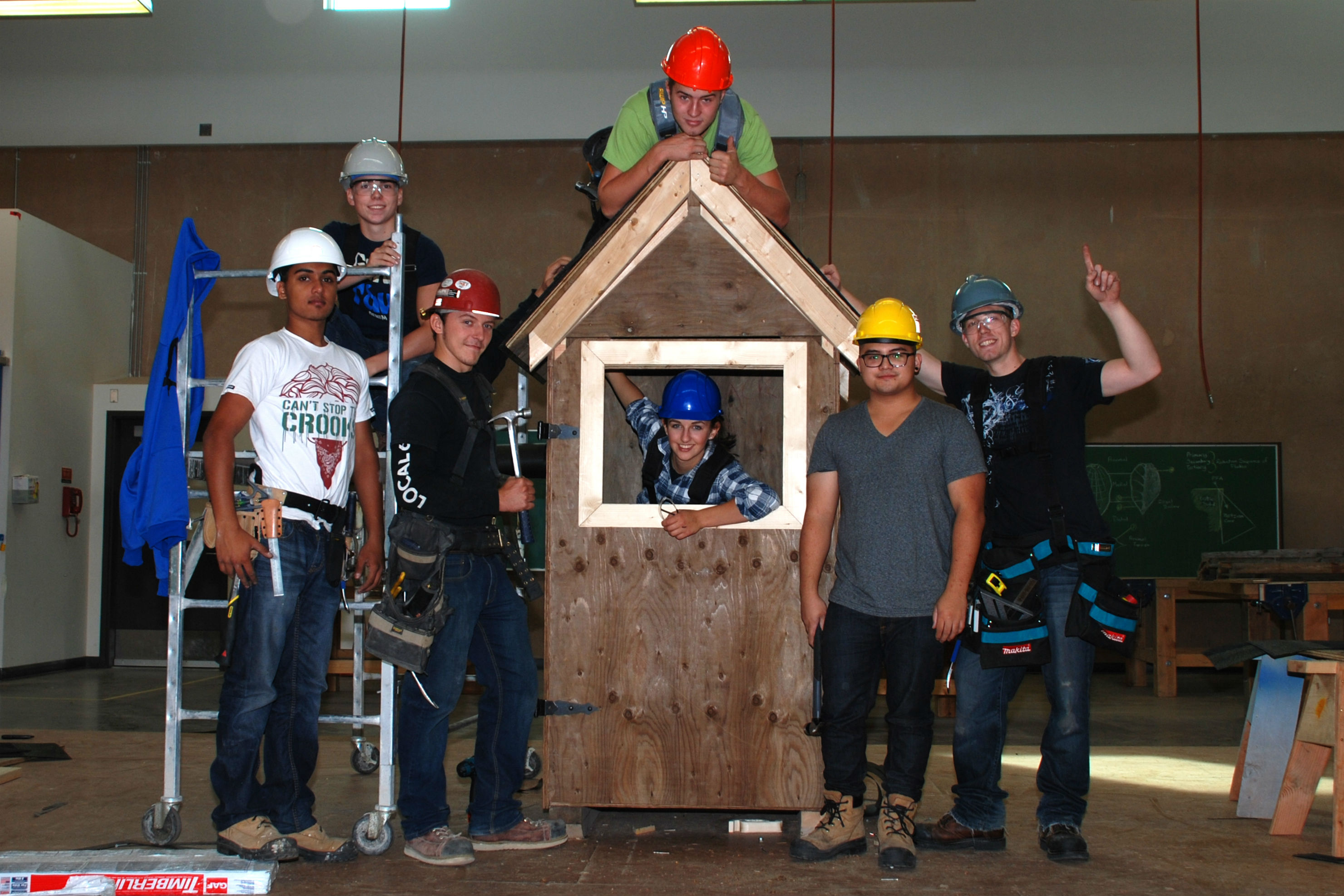 carpentry students with project