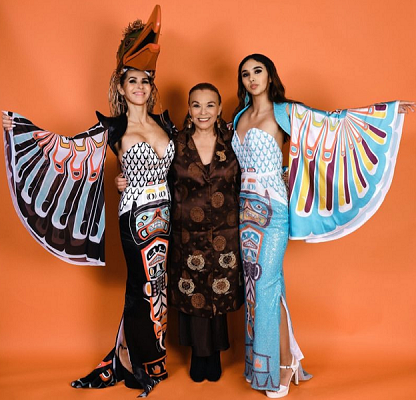 Pamela Baker, alongside Andrea (left) and Aysha (right) Alfred, showcasing haute couture family history evening dresses.