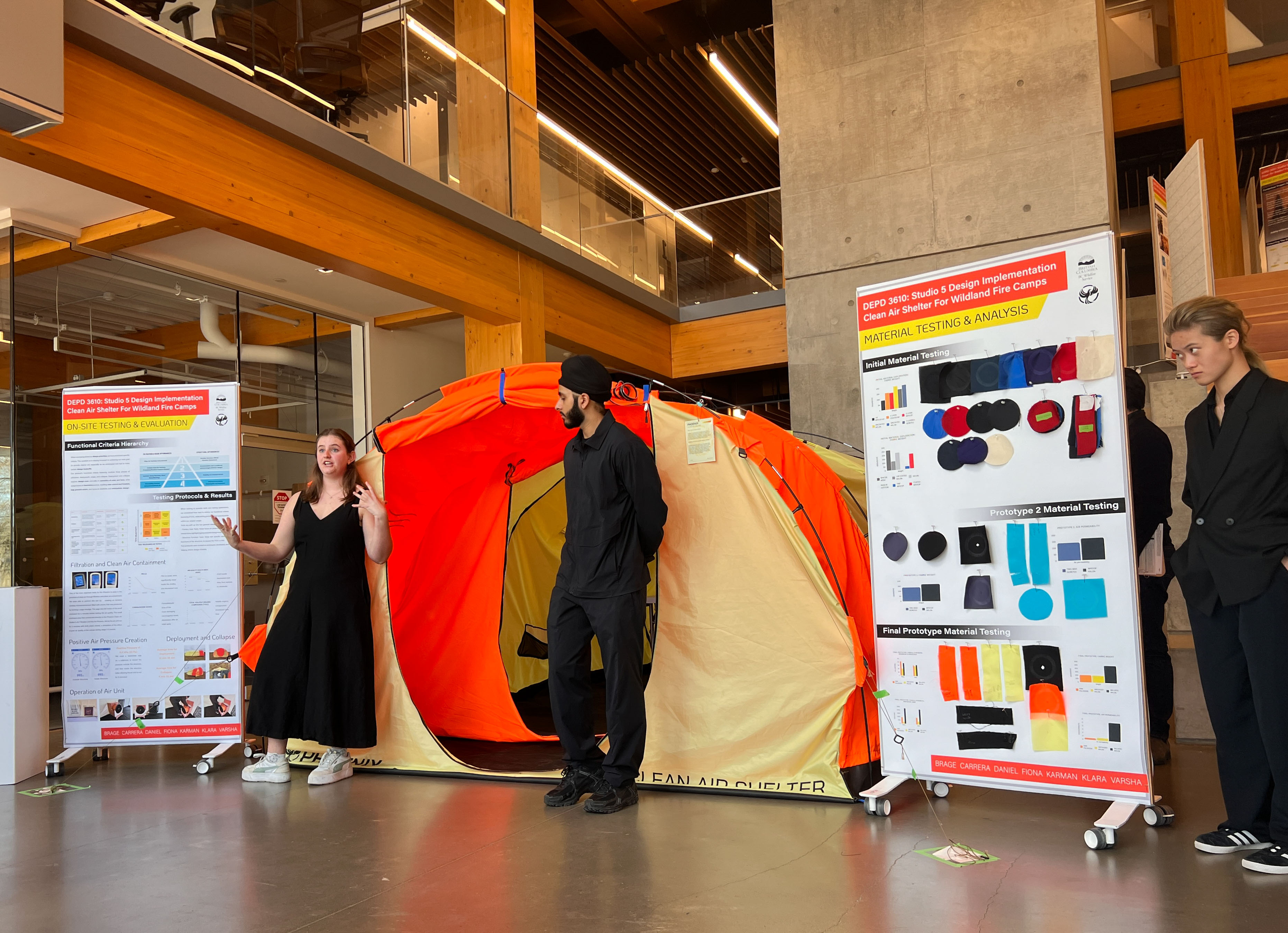 Students presenting a fire camp tent