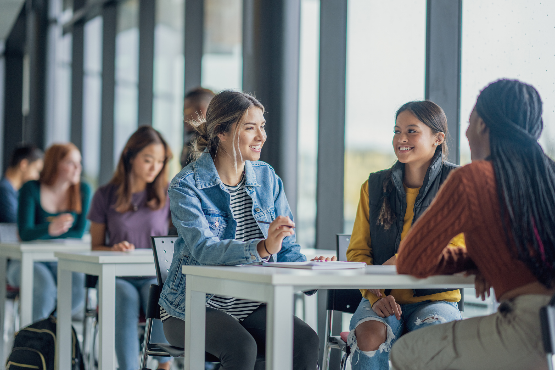 Three students studying at a table