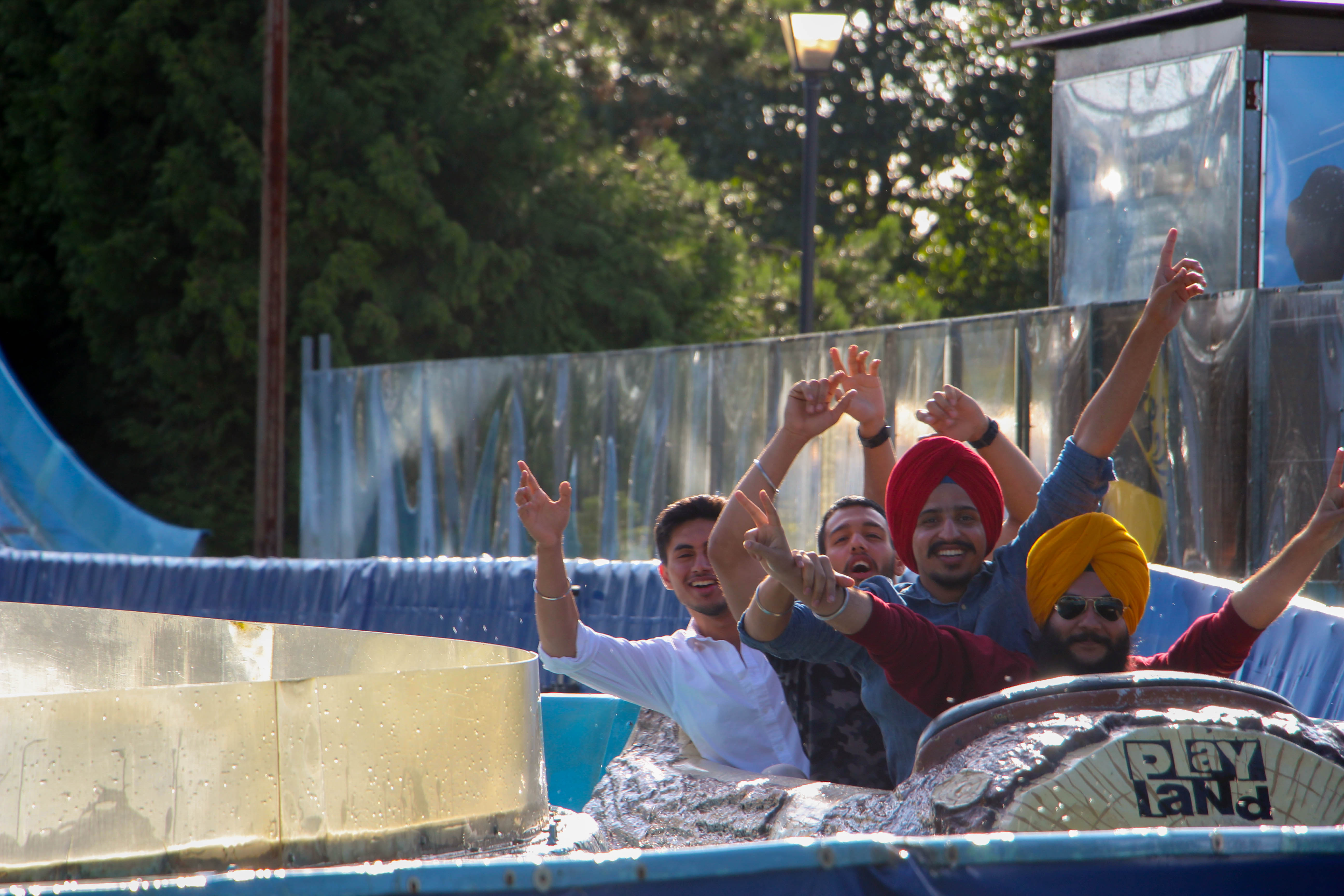 students on water slide at playland