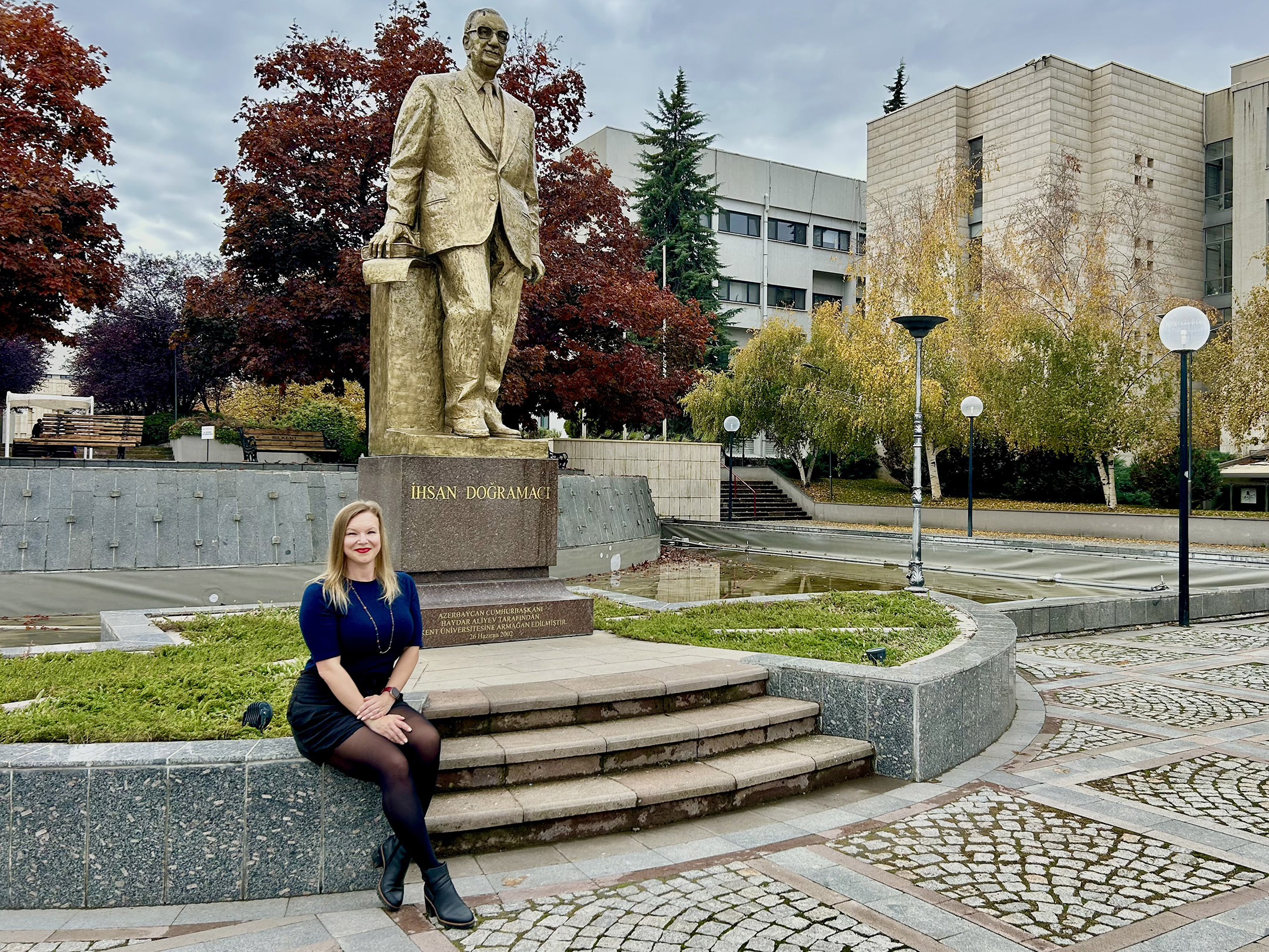 Dr. Kelly Doyle sites in main campus square at Bilkent University.