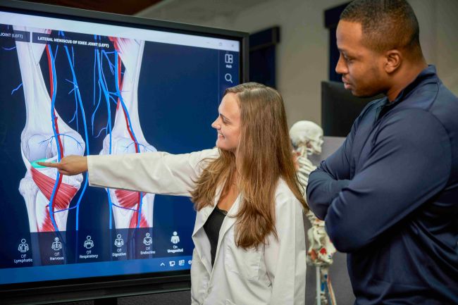 A student looks at a medical exam.