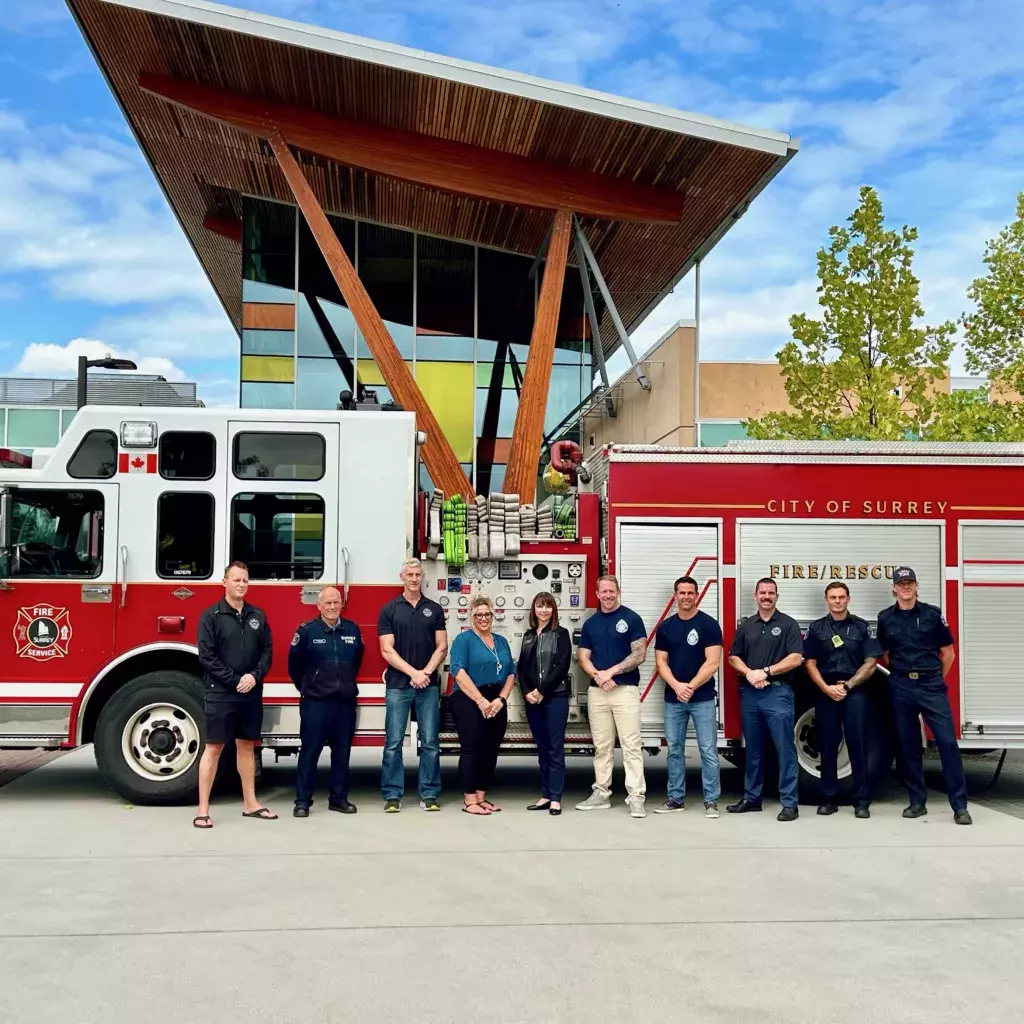 Surrey firefighters at KPU Tech with Jen Temple of the Gary and Gail Grelish Foundation, and Karen Hammond, Director of Advancement at KPU.
