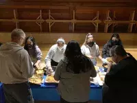 KPU nursing students serve food at the Kwantlen First Nation longhouse