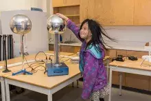 An attendee at Science Rendezvous at Kwantlen Polytechnic University Langley campus participates in experiment. 