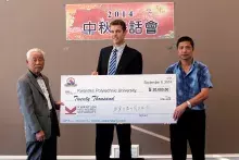 (From left) Tiensu Tsang, honorary president of the Wenzhou Society, presents KPUAA board member Brandon Hastings with an endowed scholarship donation, alongside current Wenzhou Society President Miaofei Pan. The cheque was presented during the Mid-Autumn