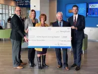 Coast Capital Savings hands $500,000 cheque to Dr. Alan Davis, Steve Lewarne and Marlyn Graziano as they donate to support Surrey students at KPU.
