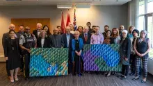 Representatives of KPU, NEVR and SAFE with the paintings presented as awards