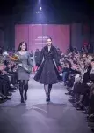 Nicole Boyer (left) walks down the runway with the model wearing her award-winning garment. [Photo credit: Geneviève Giguère]