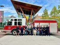 Surrey firefighters at KPU Tech with Jen Temple of the Gary and Gail Grelish Foundation, and Karen Hammond, Director of Advancement at KPU.